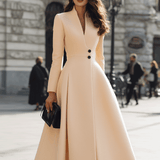 Krémové dlouhé kabátové šaty s elegantním lemem